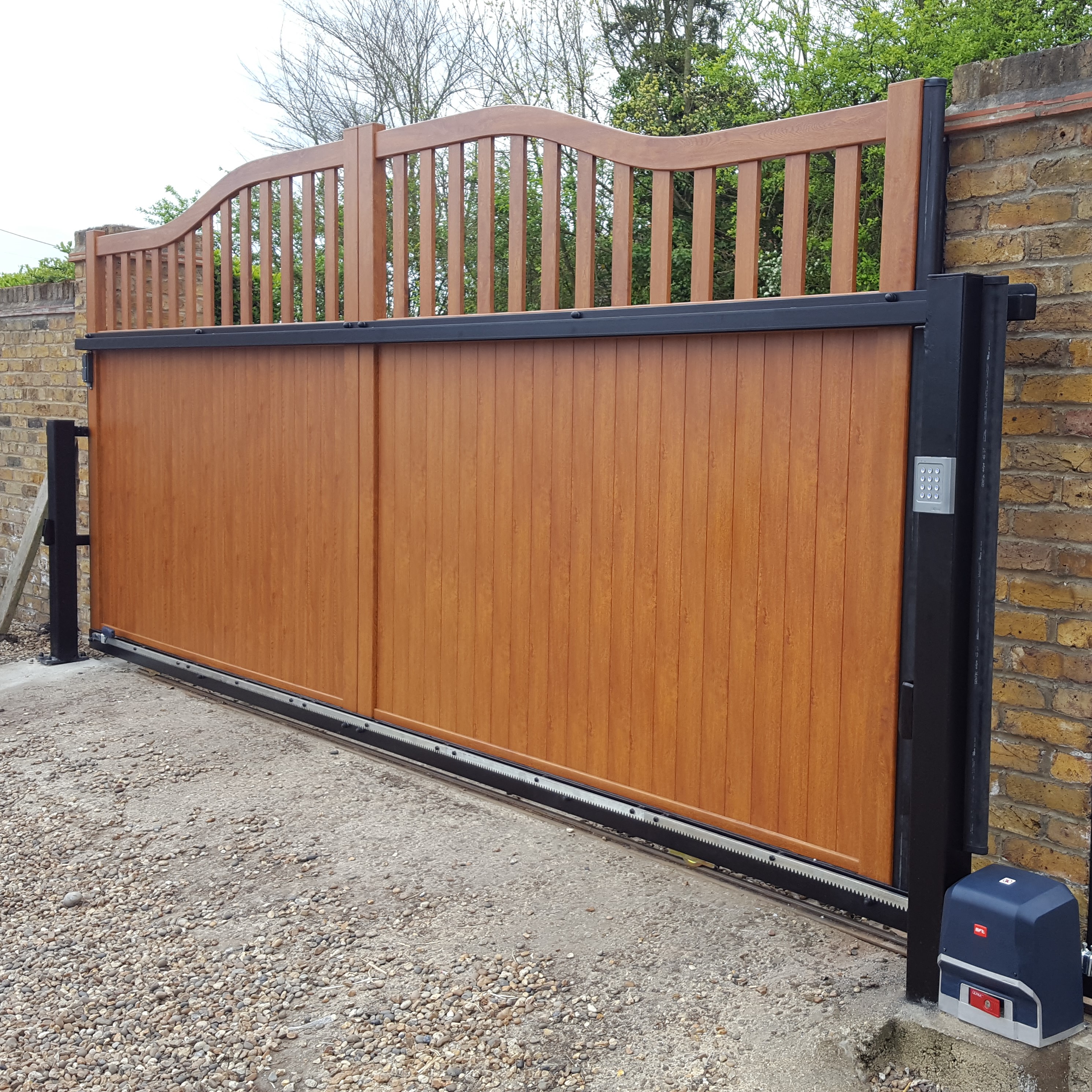 Sliding driveway gate with keypad for egress